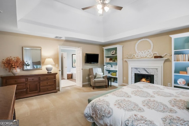 6380 Bannerhorn Run, Alpharetta, GA 30005 - bedroom featuring light colored carpet, a raised ceiling, a premium fireplace, ensuite bathroom, and a ceiling fan