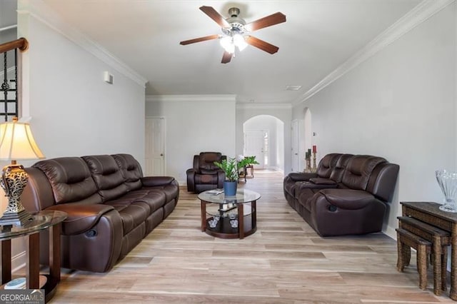 1147 Scenic Park Trl, Lawrenceville, GA 30046 - living room with arched walkways, a ceiling fan, light wood-style floors, and crown molding