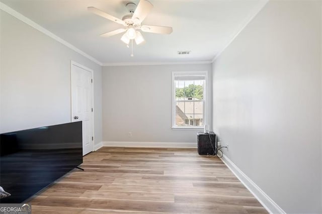 1147 Scenic Park Trl, Lawrenceville, GA 30046 - spare room featuring crown molding, wood finished floors, and a ceiling fan