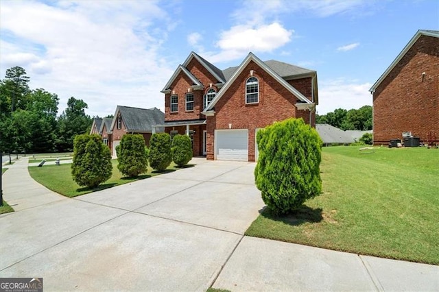 1147 Scenic Park Trl, Lawrenceville, GA 30046 - traditional-style house featuring concrete driveway, a garage, a front yard, and brick siding