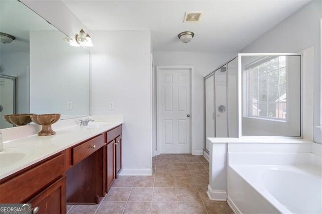 1147 Scenic Park Trl, Lawrenceville, GA 30046 - full bath with a garden tub, double vanity, a shower stall, and tile patterned flooring