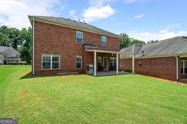 1147 Scenic Park Trl, Lawrenceville, GA 30046 - back of house with a patio area, brick siding, and a lawn