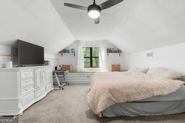 144 Winding Way, Statesboro, GA 30461 - bedroom with a textured ceiling, light colored carpet, lofted ceiling, and a ceiling fan