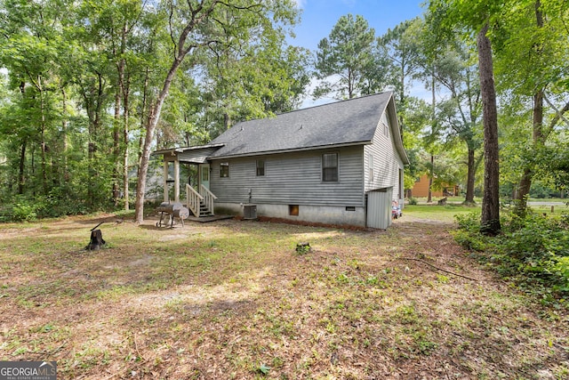 144 Winding Way, Statesboro, GA 30461 - back of property featuring roof with shingles and a sunroom