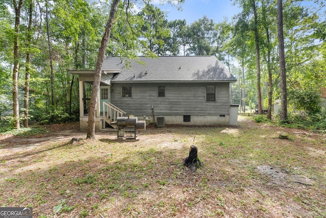 144 Winding Way, Statesboro, GA 30461 - back of property with a shingled roof and crawl space