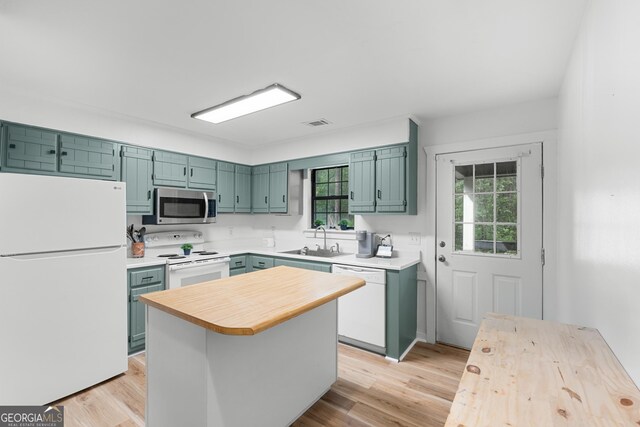 144 Winding Way, Statesboro, GA 30461 - kitchen featuring white appliances, light wood-type flooring, a center island, and wooden counters