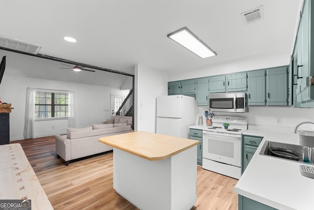 144 Winding Way, Statesboro, GA 30461 - kitchen with white appliances, light countertops, a center island, a ceiling fan, and recessed lighting