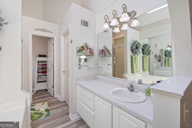 20 Knollwood Pl, Covington, GA 30014 - full bath featuring vanity, wood finished floors, and a shower with door