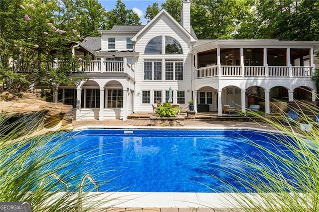 13520 Providence Lk, Alpharetta, GA 30004 - swimming pool featuring a patio area and a sunroom
