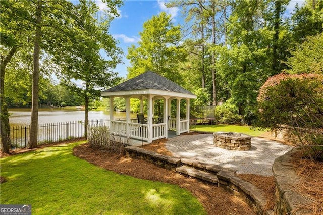 13520 Providence Lk, Alpharetta, GA 30004 - view of patio / terrace with a fire pit, a gazebo, a water view, and view of wooded area