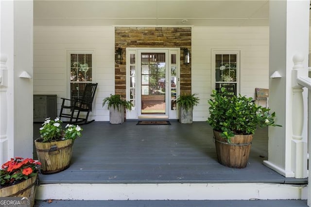 13520 Providence Lk, Alpharetta, GA 30004 - view of exterior entry with a porch and stone siding