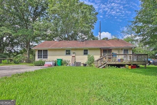 4636 Chamblee Tucker Rd, Tucker, GA 30084 - rear view of property with a deck and a lawn
