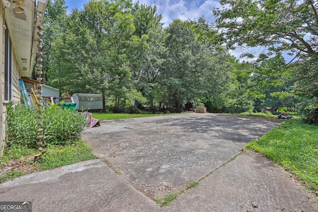 4636 Chamblee Tucker Rd, Tucker, GA 30084 - view of patio / terrace featuring a storage unit