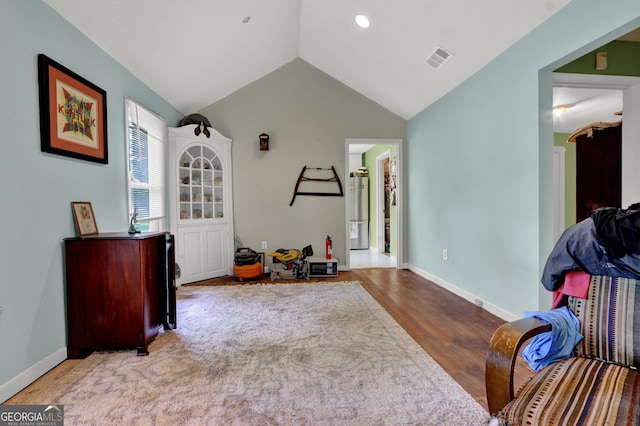 4636 Chamblee Tucker Rd, Tucker, GA 30084 - playroom featuring water heater, lofted ceiling, and wood finished floors
