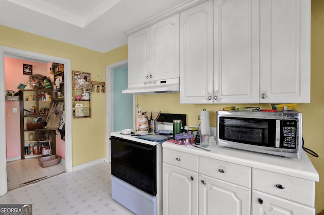 4636 Chamblee Tucker Rd, Tucker, GA 30084 - kitchen featuring stainless steel microwave, white electric range, under cabinet range hood, light floors, and white cabinetry