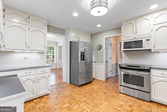 829 Bev Ct, Lawrenceville, GA 30046 - kitchen with stainless steel appliances, decorative backsplash, a textured ceiling, ornamental molding, and recessed lighting