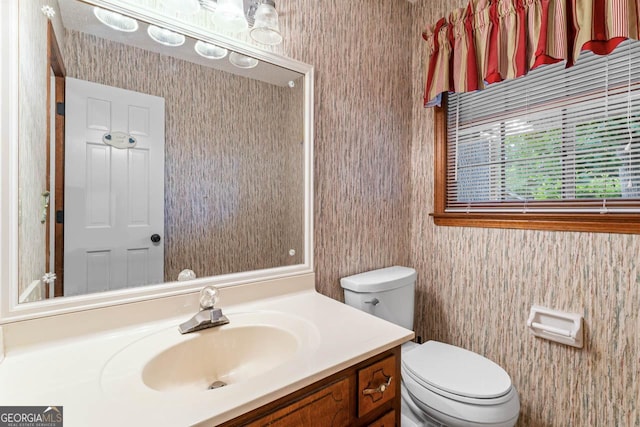 829 Bev Ct, Lawrenceville, GA 30046 - half bathroom featuring vanity and wallpapered walls