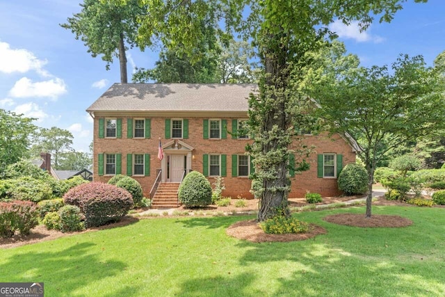 829 Bev Ct, Lawrenceville, GA 30046 - colonial house with a front yard and brick siding