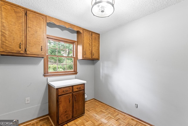 829 Bev Ct, Lawrenceville, GA 30046 - laundry room with a textured ceiling and baseboards