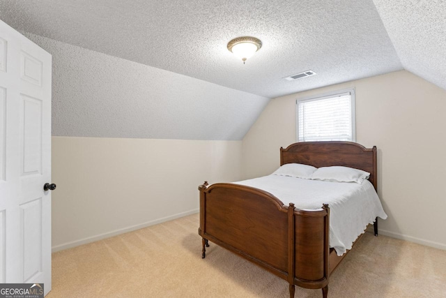 829 Bev Ct, Lawrenceville, GA 30046 - bedroom with lofted ceiling, carpet floors, and a textured ceiling