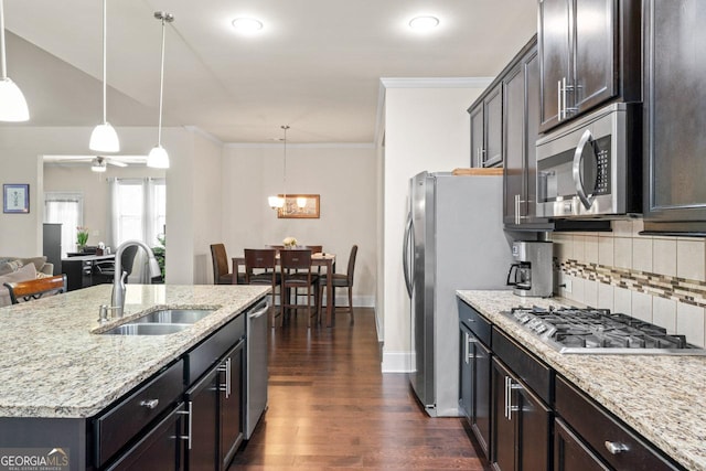 2844 Bluestone Dr SW, South Fulton, GA 30331 - kitchen featuring stainless steel appliances, dark wood-type flooring, tasteful backsplash, light stone countertops, and hanging light fixtures