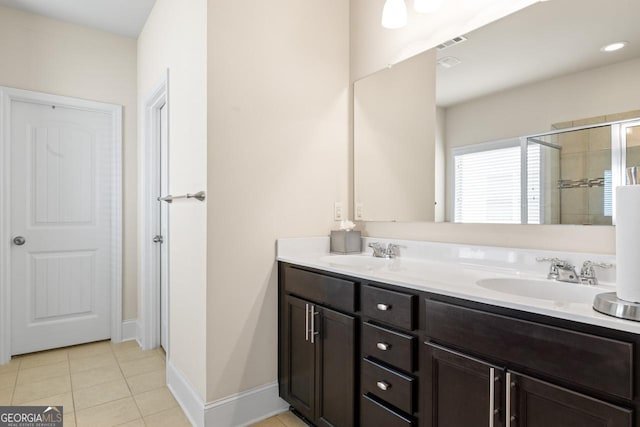 2844 Bluestone Dr SW, South Fulton, GA 30331 - full bath featuring double vanity, tile patterned floors, and tiled shower