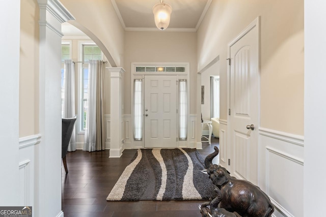 2844 Bluestone Dr SW, South Fulton, GA 30331 - entryway featuring arched walkways, wood finished floors, crown molding, wainscoting, and a decorative wall