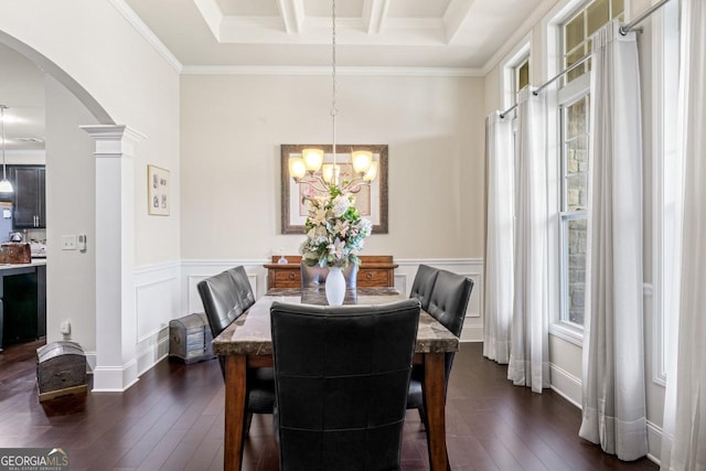 2844 Bluestone Dr SW, South Fulton, GA 30331 - dining space featuring arched walkways, dark wood-type flooring, a wainscoted wall, a chandelier, and crown molding