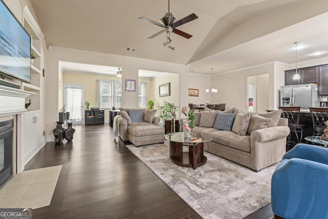 2844 Bluestone Dr SW, South Fulton, GA 30331 - living room featuring lofted ceiling, a tile fireplace, dark wood finished floors, and ceiling fan