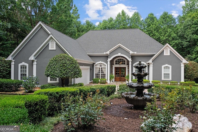 9125 Patrick Pl, Winston, GA 30187 - view of front of house featuring stucco siding, a garage, and french doors