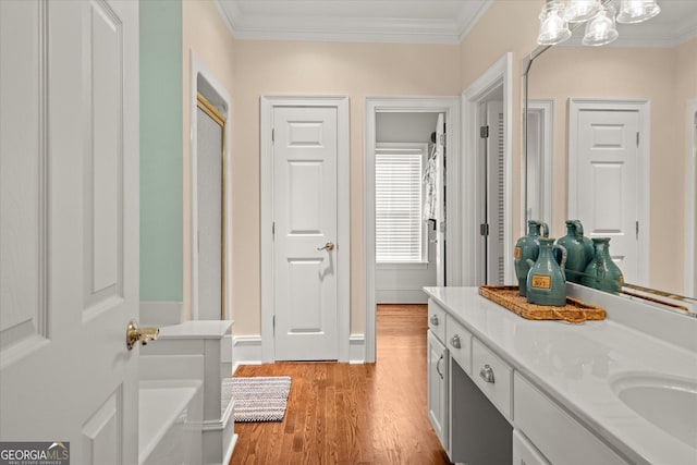 9125 Patrick Pl, Winston, GA 30187 - hallway featuring light wood-type flooring, crown molding, and a chandelier