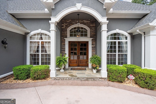 9125 Patrick Pl, Winston, GA 30187 - property entrance featuring stucco siding, stone siding, french doors, and a shingled roof