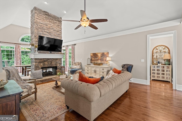 9125 Patrick Pl, Winston, GA 30187 - living room featuring lofted ceiling, ceiling fan, a fireplace, wood finished floors, and recessed lighting