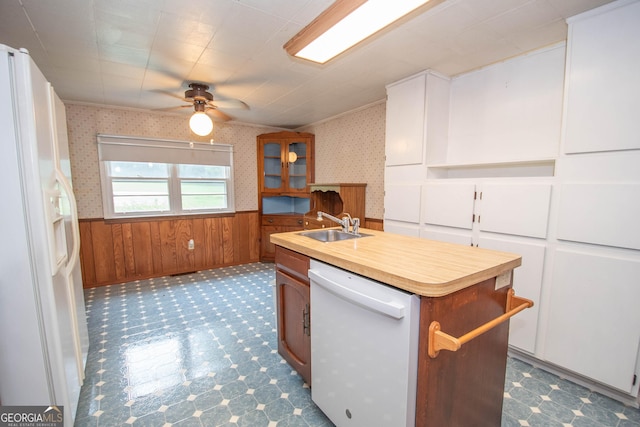 195 Hudgen Rd, Newnan, GA 30265 - kitchen featuring white appliances, ceiling fan, a center island with sink, a wainscoted wall, and tile patterned floors