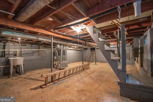 195 Hudgen Rd, Newnan, GA 30265 - unfinished below grade area featuring stairs and heating unit