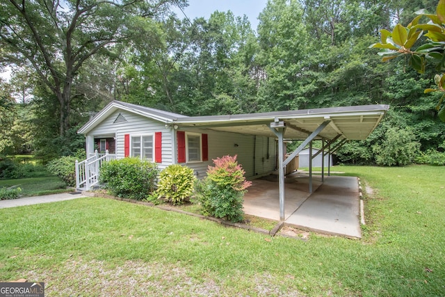 195 Hudgen Rd, Newnan, GA 30265 - view of front of property featuring a front lawn and a carport