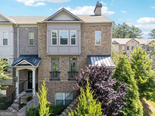 2520 Carmel Way, Alpharetta, GA 30009 - view of property featuring brick siding and a chimney