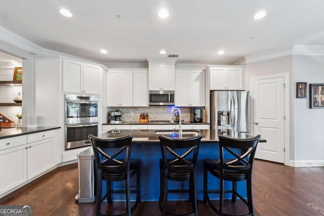 2520 Carmel Way, Alpharetta, GA 30009 - kitchen featuring appliances with stainless steel finishes, dark countertops, ornamental molding, dark wood-style flooring, and backsplash