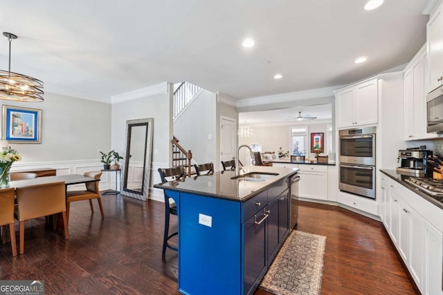 2520 Carmel Way, Alpharetta, GA 30009 - kitchen featuring appliances with stainless steel finishes, a kitchen bar, ornamental molding, a chandelier, and white cabinets