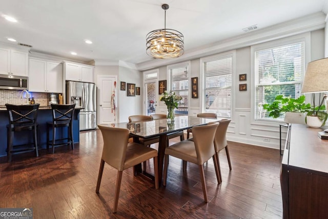 2520 Carmel Way, Alpharetta, GA 30009 - dining room with ornamental molding, recessed lighting, a chandelier, a wainscoted wall, and dark wood-style floors