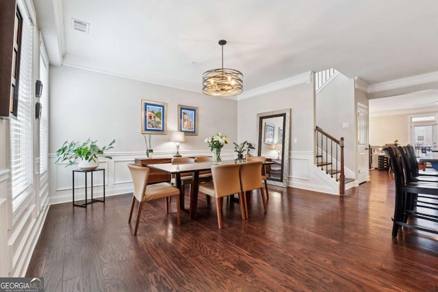 2520 Carmel Way, Alpharetta, GA 30009 - dining space with a chandelier, stairs, wood finished floors, crown molding, and wainscoting