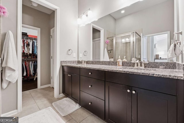 2520 Carmel Way, Alpharetta, GA 30009 - bathroom with double vanity, a stall shower, a spacious closet, and tile patterned flooring