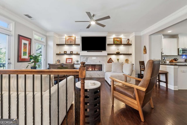 2520 Carmel Way, Alpharetta, GA 30009 - living area featuring crown molding, dark wood-style floors, a premium fireplace, and a ceiling fan