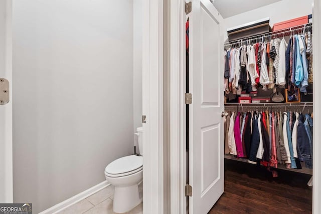 2520 Carmel Way, Alpharetta, GA 30009 - bathroom with a spacious closet and wood finished floors