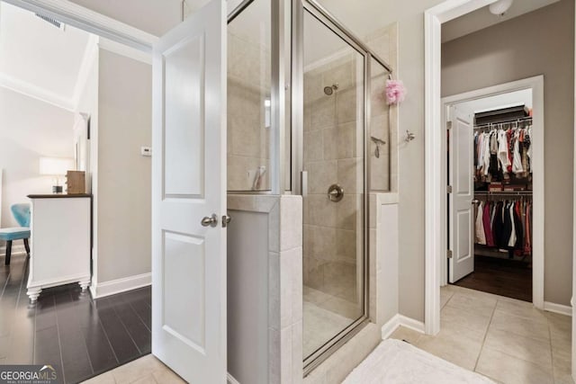 2520 Carmel Way, Alpharetta, GA 30009 - bathroom with a shower stall, a walk in closet, and tile patterned floors