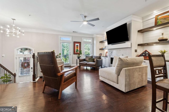 2520 Carmel Way, Alpharetta, GA 30009 - living room featuring crown molding, dark wood-style flooring, ceiling fan, a fireplace, and a chandelier