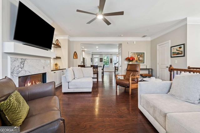 2520 Carmel Way, Alpharetta, GA 30009 - living room featuring a ceiling fan, dark wood-style floors, crown molding, and a premium fireplace
