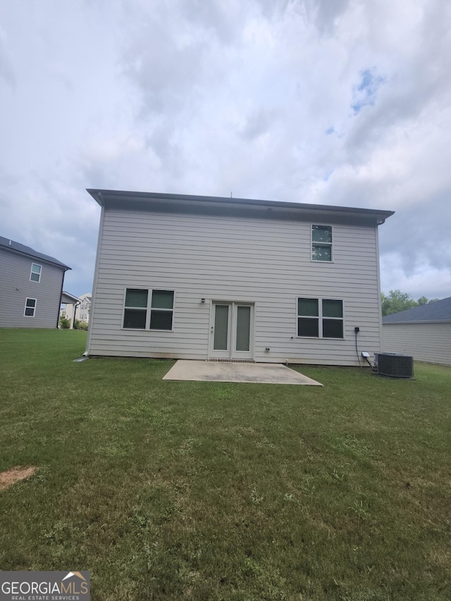 160 Grafton St, Hampton, GA 30228 - back of property with a patio and a lawn