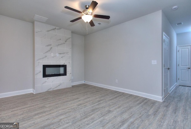 117 Greenview Ct Unit 1302, Homer, GA 30547 - unfurnished living room featuring wood finished floors, a high end fireplace, and ceiling fan