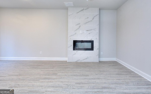 117 Greenview Ct Unit 1302, Homer, GA 30547 - unfurnished living room featuring a premium fireplace and wood finished floors